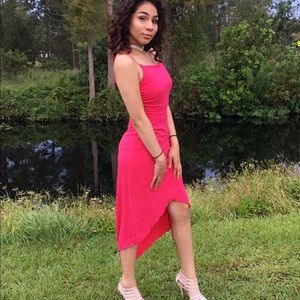 A pink mid length dress that is hot pink